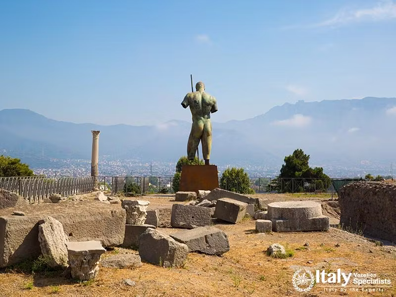 Man statue on square of ancient city of Pompei, Naples, Italy.