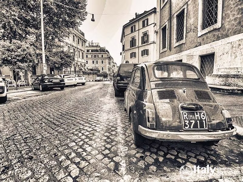 ROME - JUNE 14 Vintage red Fiat 500 parked in Via della Cosulta on June 14, 2014 in Rome, Italy. The