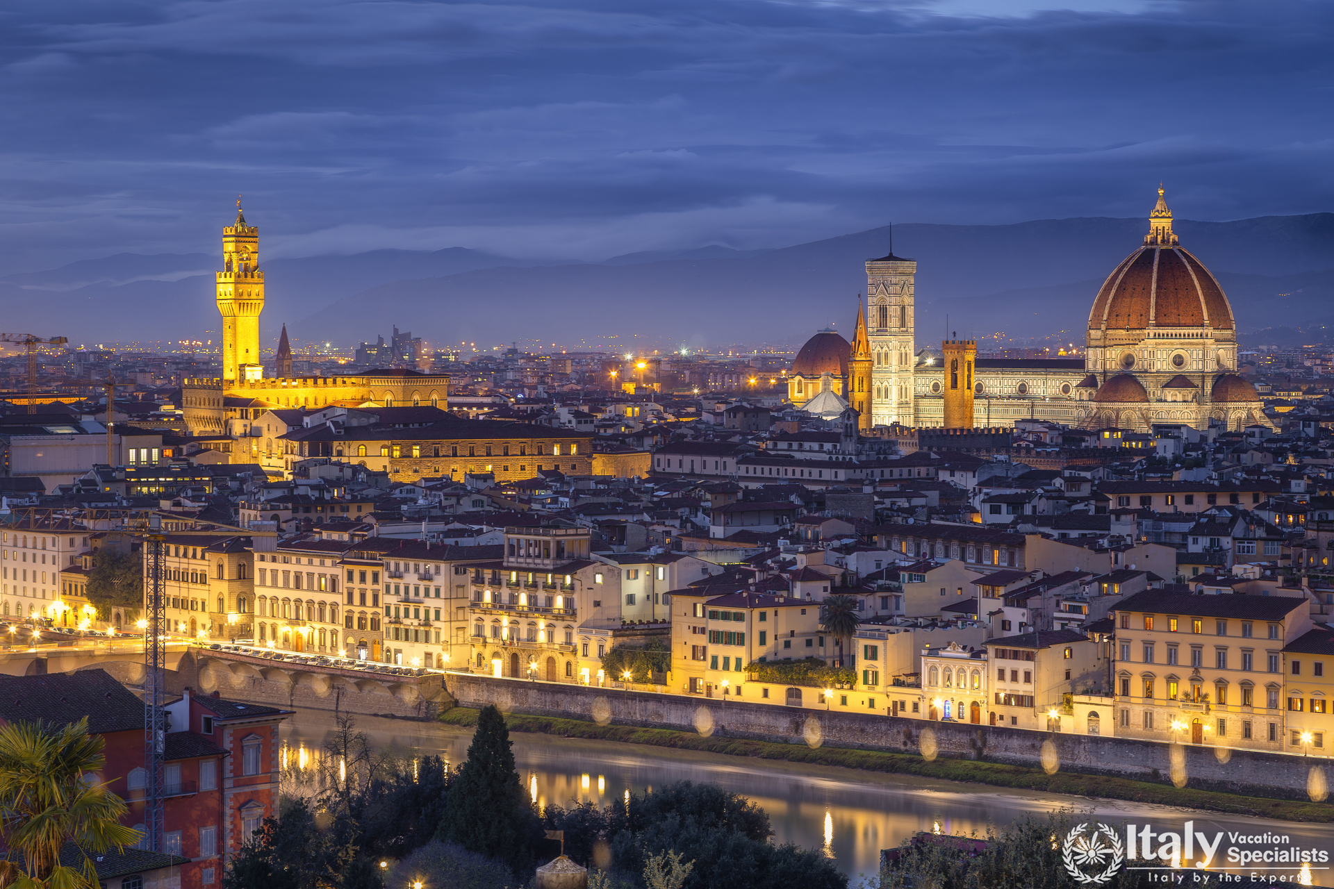 The skyline of Florence at dusk, with Palazzo Vecchio and the Duomo