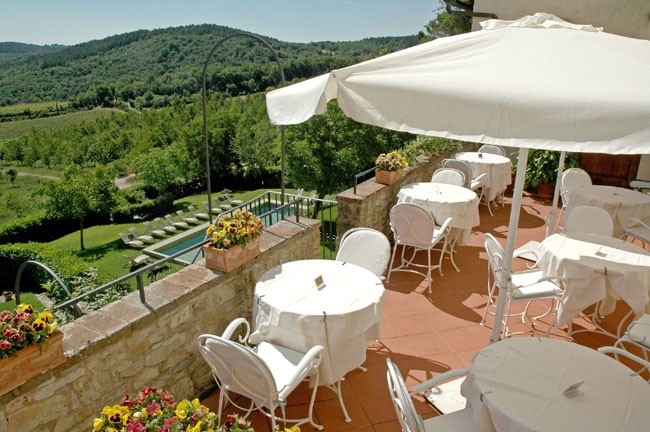 Terrace overlooking Tuscan countryside at the Palazzo Squarcialupi 