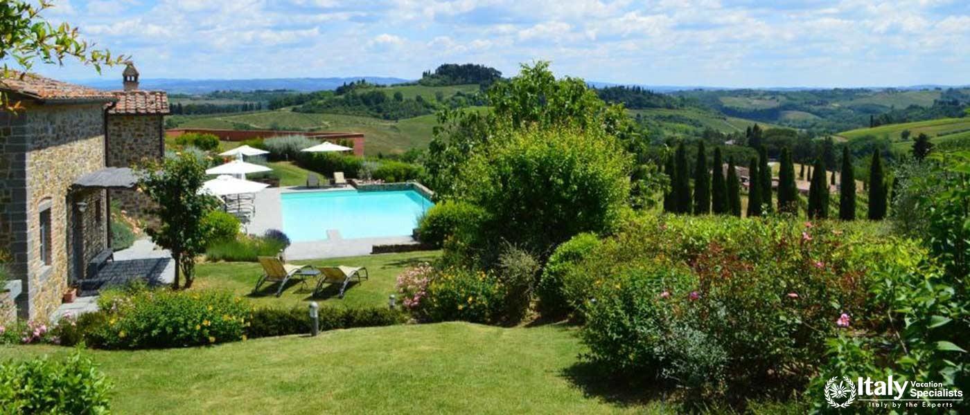 A stunning view of the swimming pool and surrounding vineyards at Guardastelle Winery.