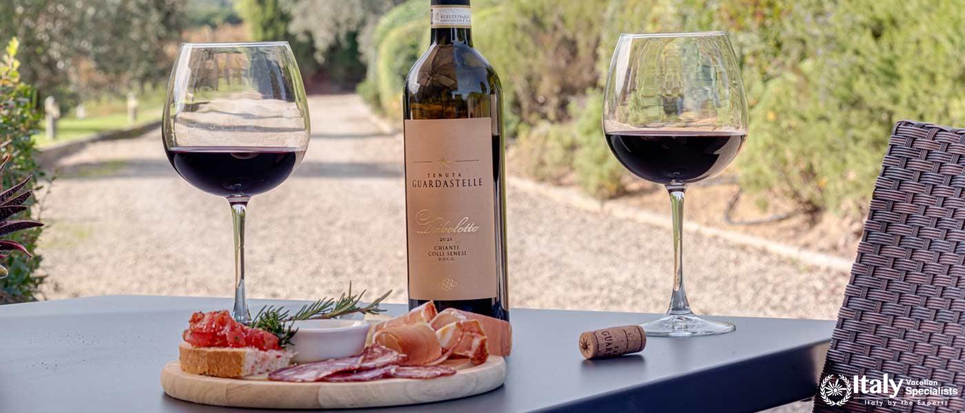 Savor the rich flavors of Guardastelle's Chianti Colli Senesi paired with delectable local delicacie