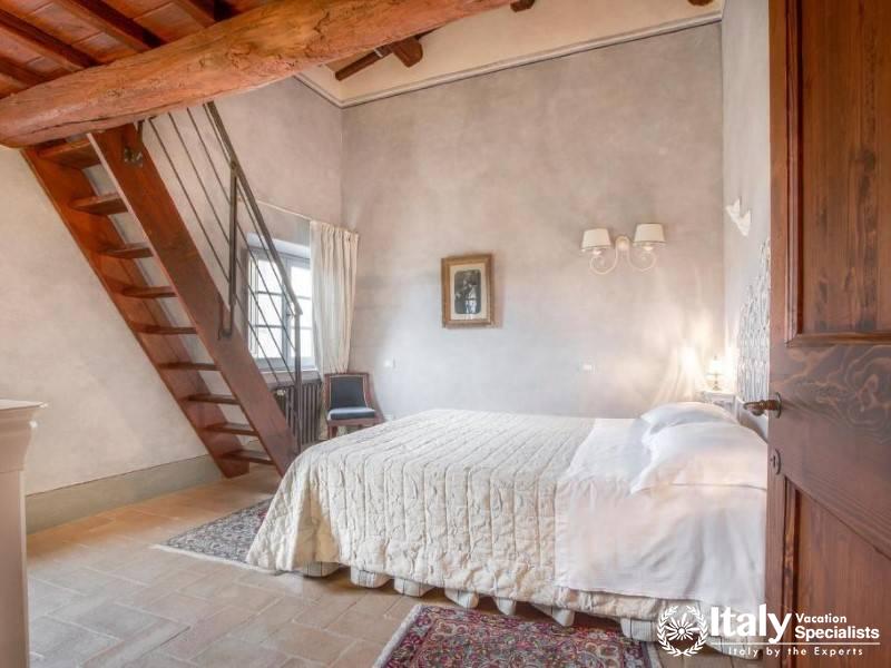 A spacious and inviting bedroom with a loft, perfect for a comfortable and memorable stay .