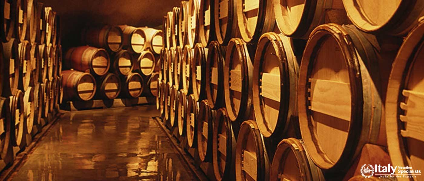 Explore the historic wine cellars, where the rich Vino Nobile di Montepulciano is aged to perfection