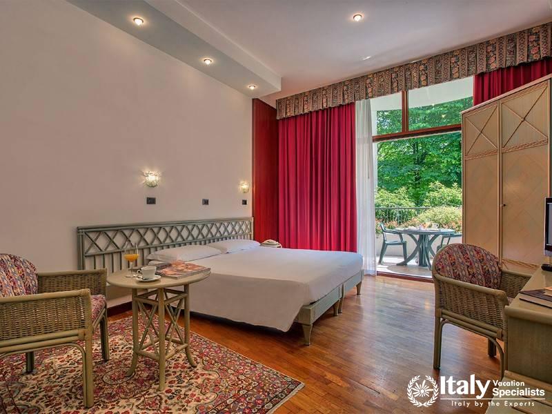 Enjoy a cozy retreat in our room with a charming garden view and private balcony.