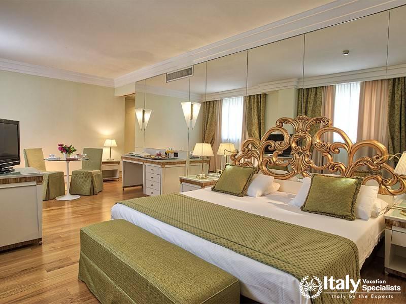 Experience luxury and comfort in our elegantly designed room, featuring opulent decor.