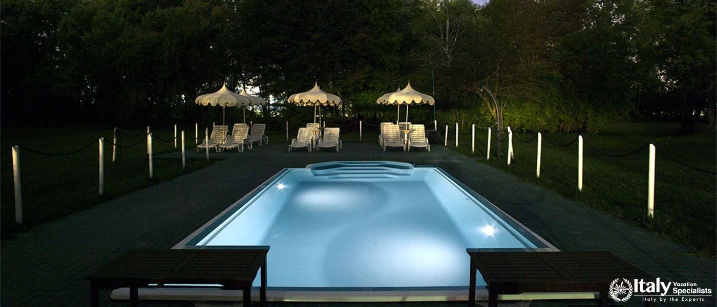 Take a dip in our serene outdoor pool, surrounded by natureâ€™s tranquility.