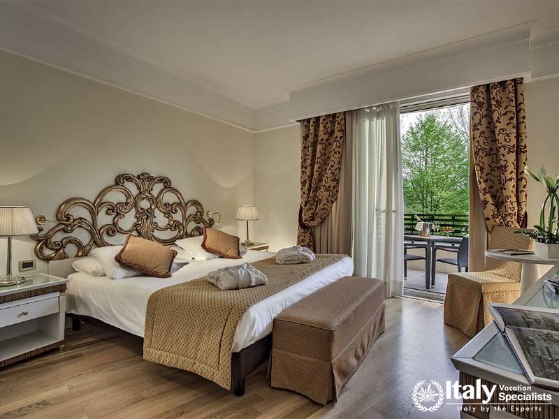 Experience elegance and comfort in our tastefully decorated room with balcony access.