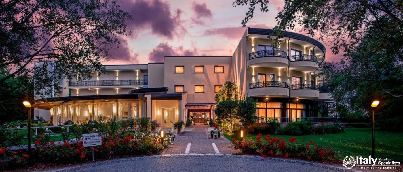 Experience the beauty of Park Hotel Junior at sunset, where elegance meets nature.