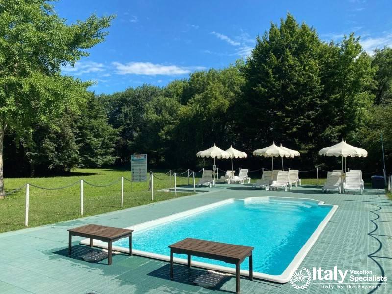 Soak up the sun by our refreshing outdoor pool, surrounded by lush greenery.