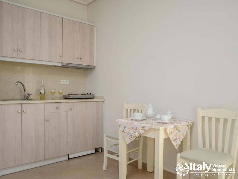 Simple and inviting kitchenette area at Perla Hotel in Naxos, Greece Simple and inviting kitchenette area at Perla Hotel in Naxos, Greece