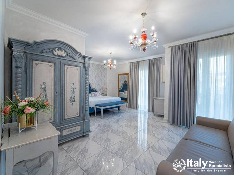 Sophisticated bedroom suite at Hotel Colomba D'Oro in Tropea, Italy