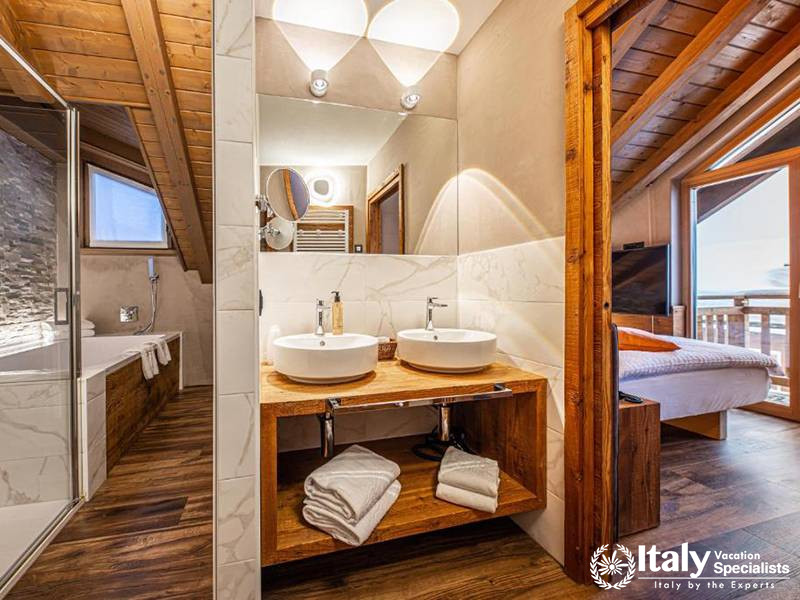 Stylish Bathroom with Double Sinks in Bivio Hotel Plaza in Livigno, Italy