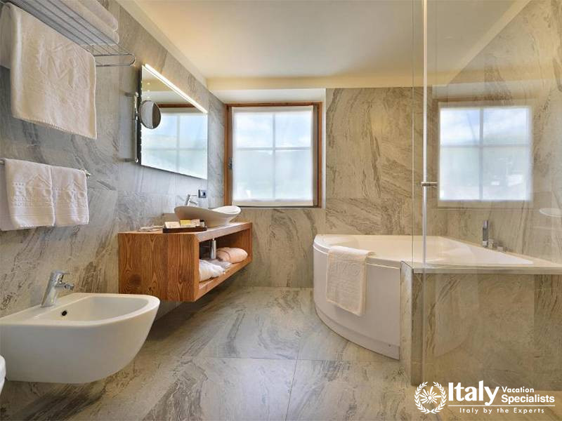 Luxurious Bathroom with a Bathtub in Bivio Hotel Plaza in Livigno, Italy