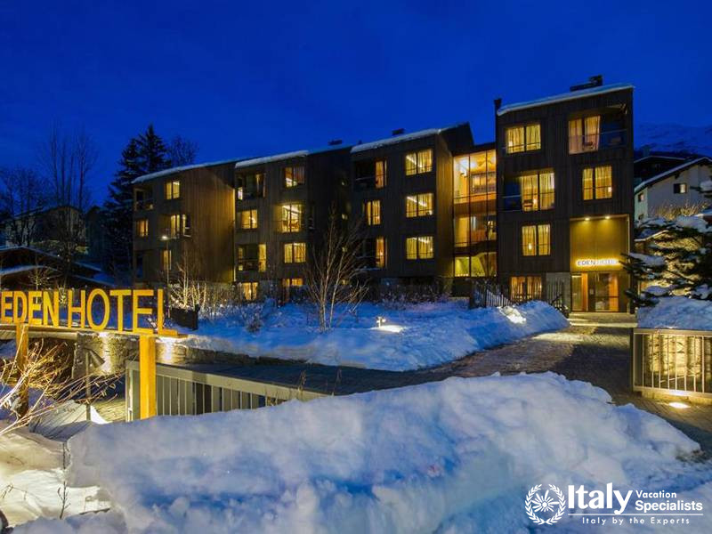 Hotel Exterior in Snow at Dusk in Eden Hotel