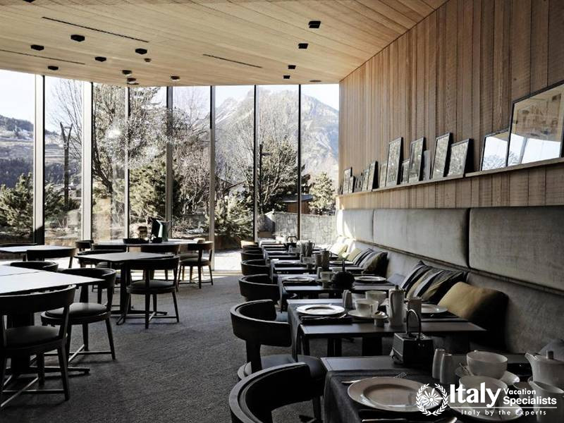 Dining Room with Panoramic Mountain Views in Eden Hotel