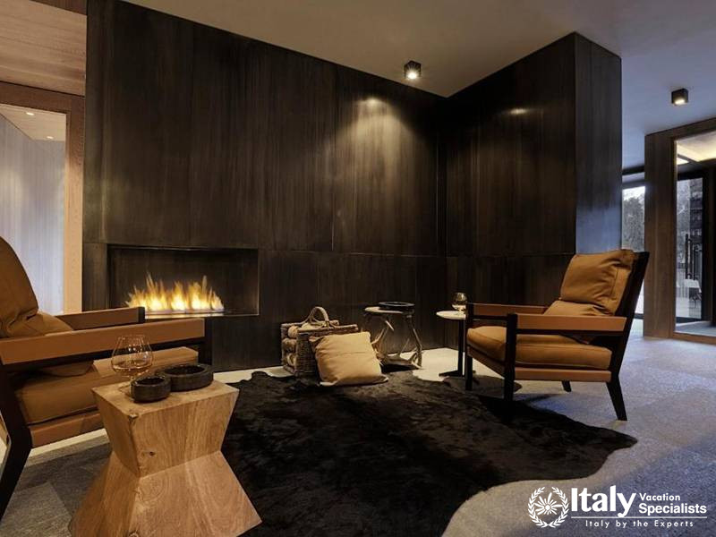 Cozy Fireplace Lounge with Minimalist Design in Eden Hotel
