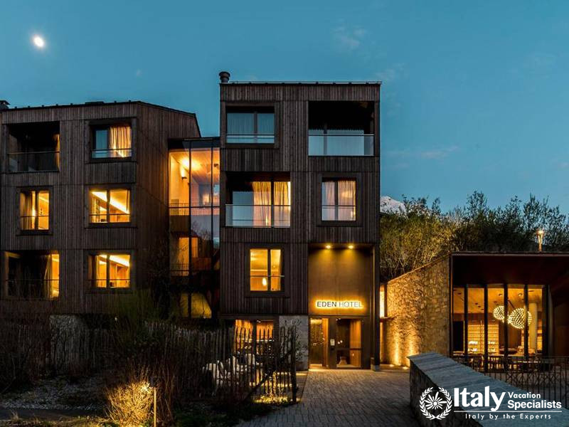 Eden Hotel Exterior with Moonlit View at Night