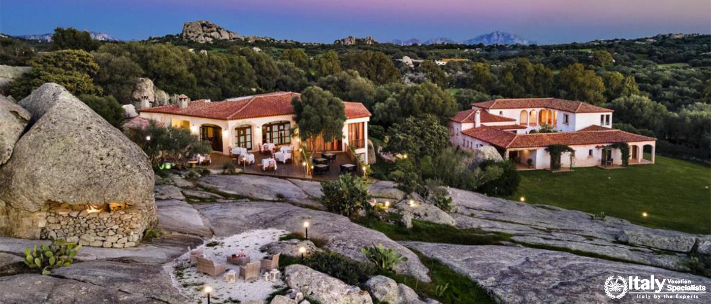 Breathtaking aerial view of the estate’s rustic buildings set against the rocky landscape