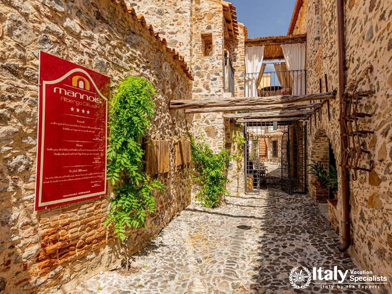 Sunny Outdoor Courtyard at Albergo Diffuso Mannois, Orosei, Sardinia