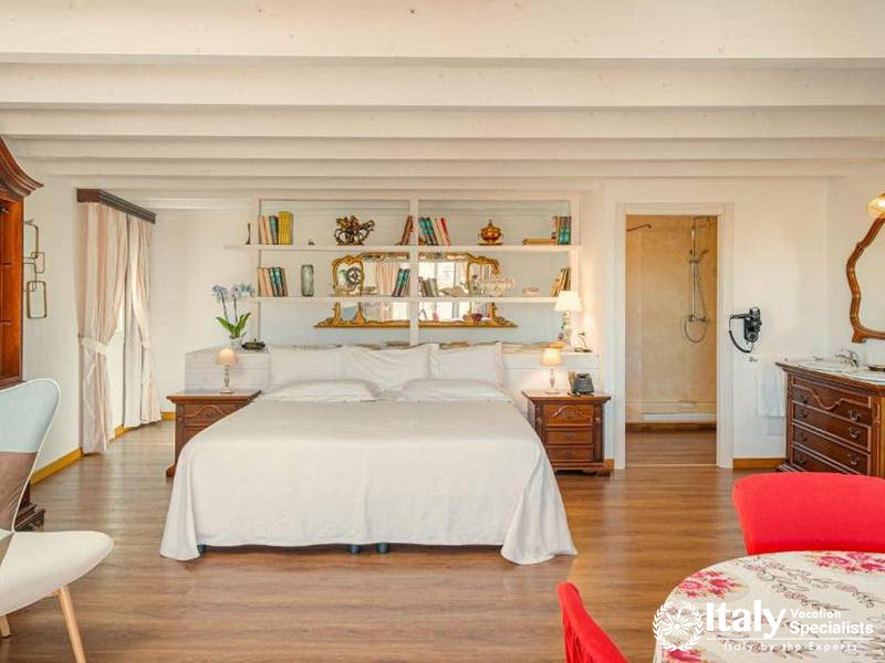 Stylish Bedroom with Antique Charm at Albergo Diffuso Mannois