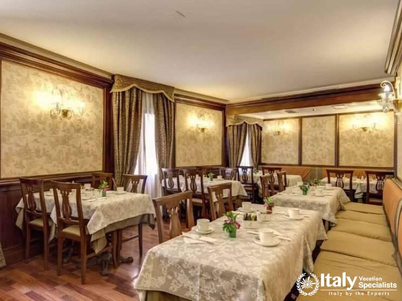 The dining rooms traditional charm invites guests to enjoy a meal together at Hotel Al Codega.