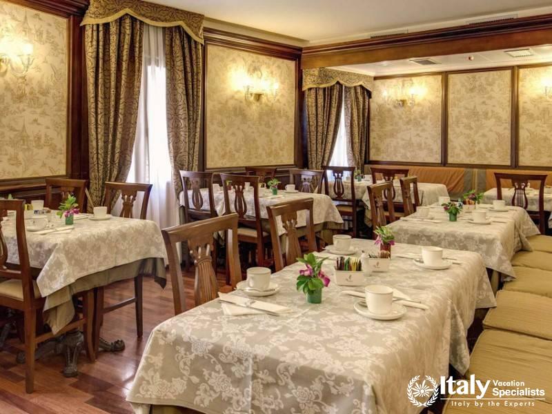 The well-appointed dining room at Hotel Al Codega, ready to welcome guests for a meal.