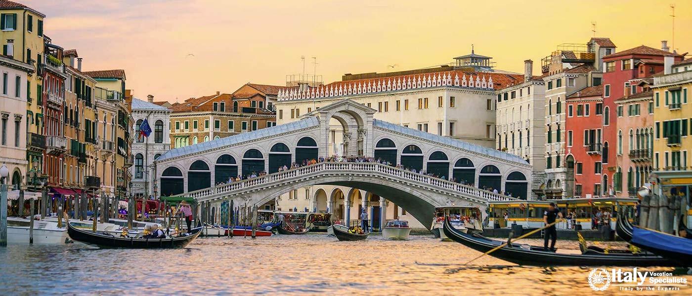 The bustling Grand Canal with the iconic Rialto Bridge near Hotel Al Codega.