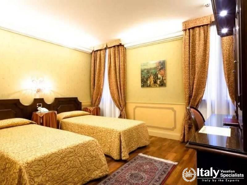 Double beds make for a cozy family or friends stay at Hotel Al Codega.