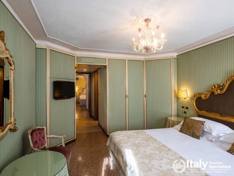 Elegant room with light green walls, golden accents, and vintage decor.