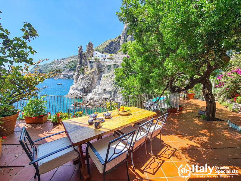 Outdoor Dining Area Overlooking the Sea in Villa Bellissima Vista Mare in Campania, Italy