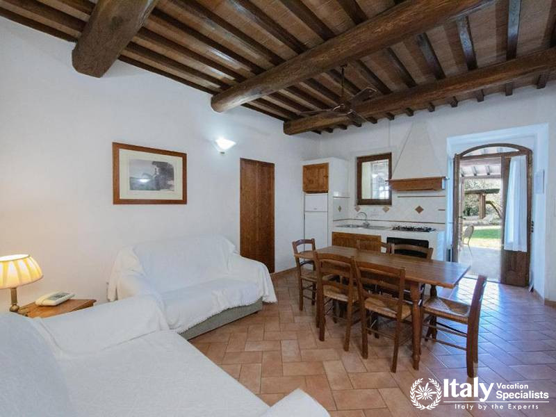 Open Living and Dining Area with Garden Access at La Dimora del Gazebo in San Gimignano, Italy