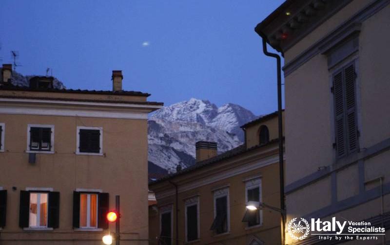 Carrara, Italy - Town by Night with Moon 
